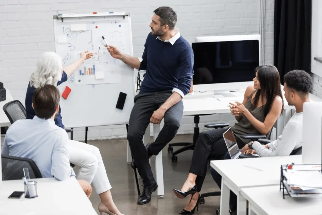 Business team discussing strategy during office meeting.