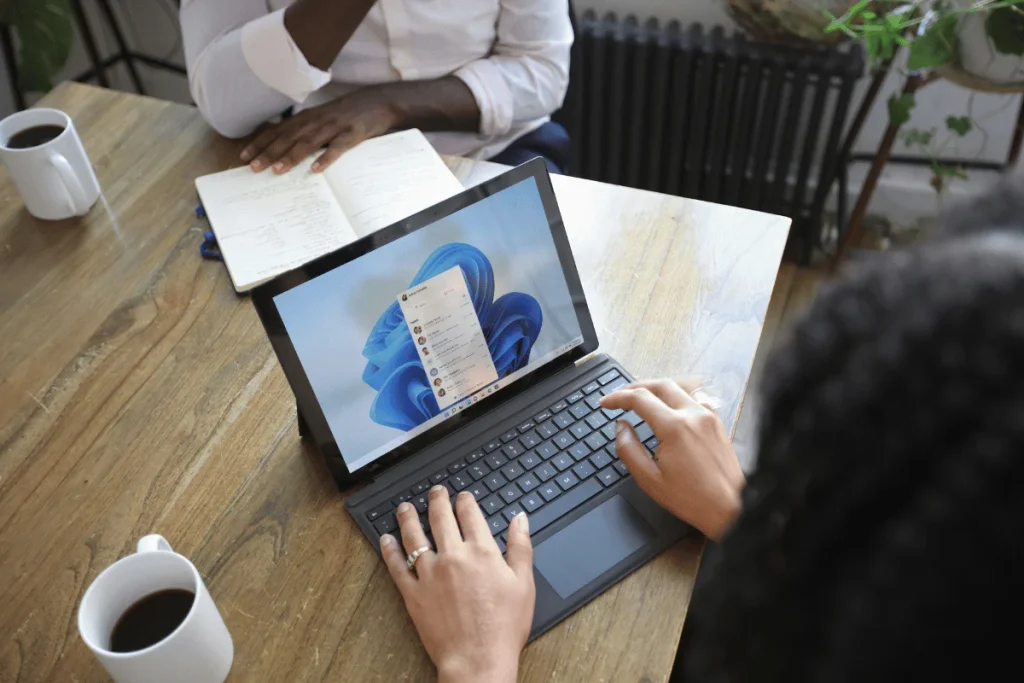 Executive assistant working on a tablet with digital workspace open.