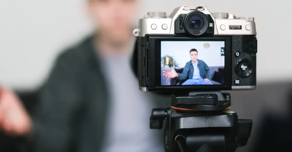 Professional mirrorless camera on tripod displaying performance content marketing video of man in business attire.